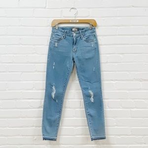 MOTHER Undone hem looker crop skinny light blue distressed jeans